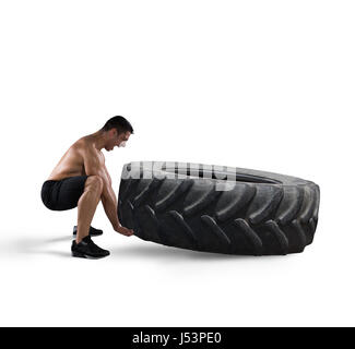 Workout with a big tire Stock Photo