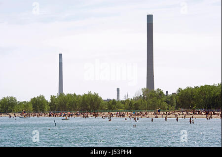 People find relief in the waters of Ontario Lake in the Beaches area of Toronto on the long weekend marking Canada Day celebrations. Temperatures in T Stock Photo