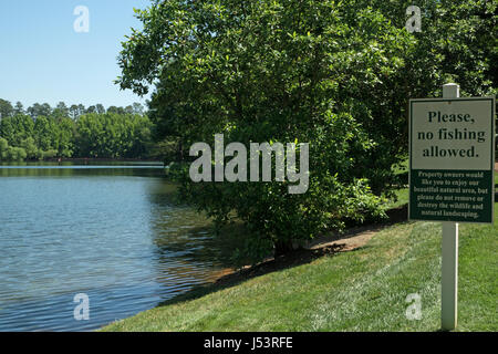 No Fishing sign at pond Stock Photo