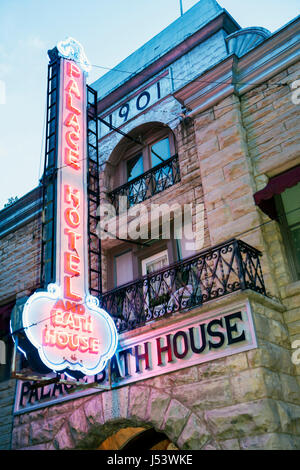 Eureka Springs Arkansas,Ozark Mountains,Palace Hotel & Bath house,houses,built 1901,neon sign,entrance,front,dusk,evening,night evening,AR080608034 Stock Photo