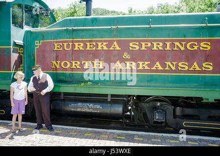 Eureka Springs Arkansas,Ozark Mountains,Eureka Springs & North Arkansas Railway,conductor,man men male,girl girls,youngster,female kids children passe Stock Photo