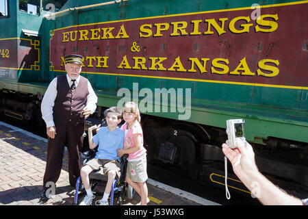 Eureka Springs Arkansas,Ozark Mountains,Eureka Springs and North Arkansas Railway,conductor,adult adults man men male,girl girls,youngster youngsters Stock Photo