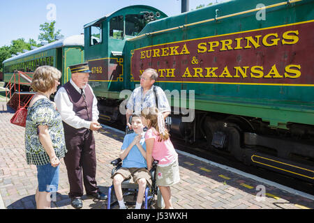 Eureka Springs Arkansas,Ozark Mountains,Eureka Springs & North Arkansas Railway,conductor,man men male,girl girls,female kids children boy boys,male d Stock Photo