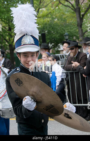 5.14.2017 A teenager in a marching band celebrating Lag B'Omer at the Lubavitch Great Parade in Crown Heights, Brooklyn, New York Stock Photo