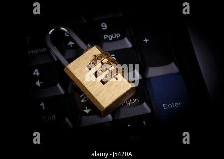 golden lock on black keyboard - computer security concept, internet privacy Stock Photo