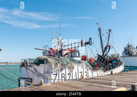 LAAIPLEK, SOUTH AFRICA - APRIL 1, 2017: A fishing trawler, showing nets and equipment, at the harbor in the mouth of the Berg River at Laaiplek on the Stock Photo
