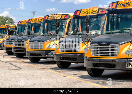 Cincinnati - Circa May 2017: Yellow School Buses in a District Lot Waiting to Depart for Students I Stock Photo