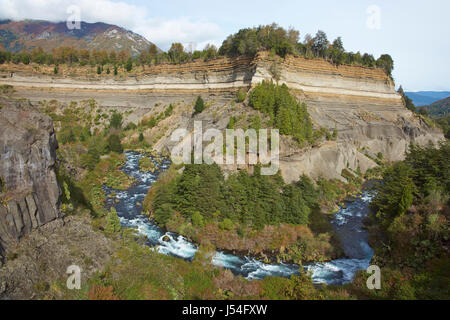 Conguillio National Park in the Araucania region of Chile. River Truful-Truful running through a deep gorge with colourful eroded cliffs. Stock Photo