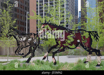 Galloping horses in Calgary “Do Re Mi Fa Sol La Si Do” by sculptor Joe Fafard for Quebec City's 400th anniversary. Calgary and Quebec are sister cities. Stock Photo