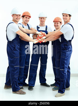 Group of professional industrial workers. Isolated over white background. Stock Photo