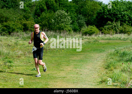 Man running in the Stratford Triathlon, Stratford-upon-Avon, UK Stock Photo