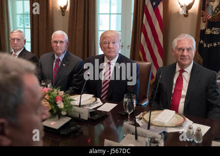 US President Donald J. Trump (C) sits with members of his administration; US Defense Secretary James Mattis (L), US Vice President Mike Pence (2-L) and Secretary of State Rex Tillerson (R) during a luncheon with President of Turkey Recep Tayyip Erdogan (not pictured) and members of the Turkish delegation, in the Cabinet Room of the White House in Washington, DC, USA, 16 May 2017. Trump and Erdogan face the issue of working out cooperation in the fight against terrorism as Turkey objects to the US arming of Kurdish forces in Syria. Credit: Michael Reynolds/Pool via CNP /MediaPunch Stock Photo