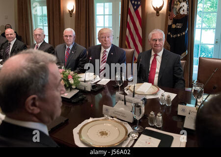 US President Donald J. Trump (C) sits with members of his administration; National Security Advisor H.R. McMaster (L), US Defense Secretary James Mattis (2-L), US Vice President Mike Pence (3-L) and Secretary of State Rex Tillerson (R) during a luncheon with President of Turkey Recep Tayyip Erdogan (not pictured) and members of the Turkish delegation, in the Cabinet Room of the White House in Washington, DC, USA, 16 May 2017. Trump and Erdogan face the issue of working out cooperation in the fight against terrorism as Turkey objects to the US arming of Kurdish forces in Syria. Credit: Michael Stock Photo