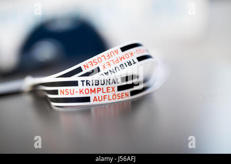 Cologne, Germany. 17th May, 2017. An armband with the words 'dissolve the NSU-complex tribunal' on a table at a press conference in Cologne, Germany, 17 May 2017. The theatre piece will take the form of a mock tribunal and will name the perpetrators not present at the actual NSU trial. Photo: Rolf Vennenbernd/dpa/Alamy Live News Stock Photo