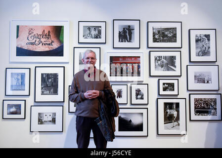 London, UK.  17 May 2017.  Magnum photographer, Martin Parr, stands in front of a collection of images.  His work 'English and Proud' is seen top left.  Preview of Photo London 2017 at Somerset House.  Now in its third edition, the event showcases the best in contemporary photography from 89 galleries from 16 different countries for collectors and enthusiasts. The show opens 18-21 May 2017.  Credit: Stephen Chung / Alamy Live News Stock Photo