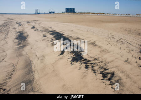 Sea Coal on beach at Hartlepool nuclear power station Stock Photo