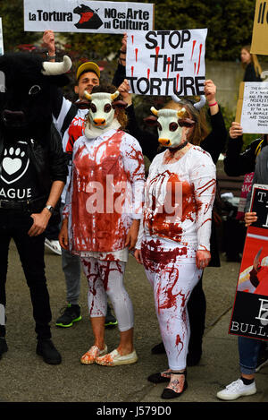 Protesters against Bullfighting splashed with fake blood ready for a demonstration march which ended outside the Spanish embassy in London Stock Photo