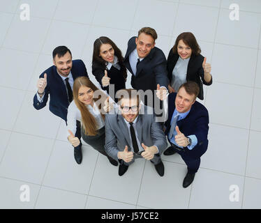 Top view of executives smiling and pointing Stock Photo - Alamy