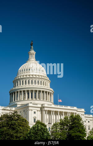 Profile of U.S. Capitol with Flag at Half-Mast, Washington, DC Stock Photo