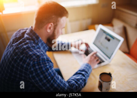 blurred background, businessman using laptop at workplace Stock Photo