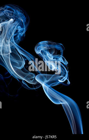 Abstract blue smoke isolated on black background Stock Photo