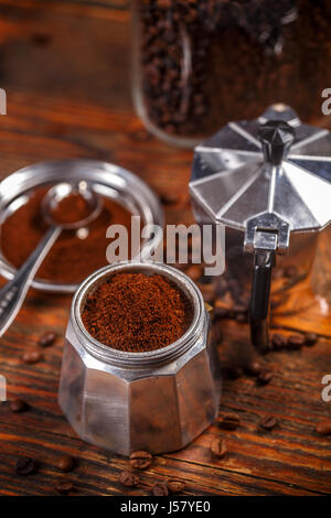 Old coffee maker in vintage style on wooden background Stock Photo