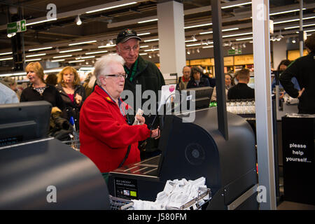 People using the self service checkout  in the Food Hall  in the Marks and Spencer store, Aberystwyth Wales UK Stock Photo