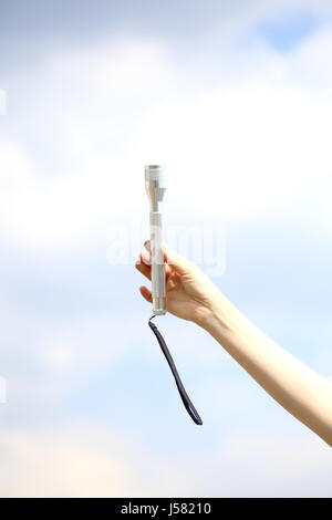 Woman Hand Holding Flashlight Stock Photo