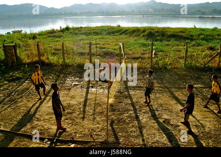 Young men playing sepak takraw near the Irrawaddy river, Pyay, Myanmar Stock Photo