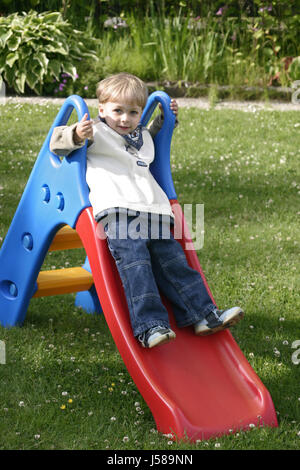 blue game tournament play playing plays played garden male masculine toy jeans Stock Photo