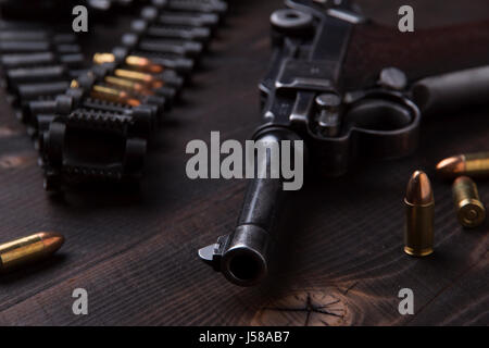 Gun Luger with cartridges and holster on the blackboard Stock Photo