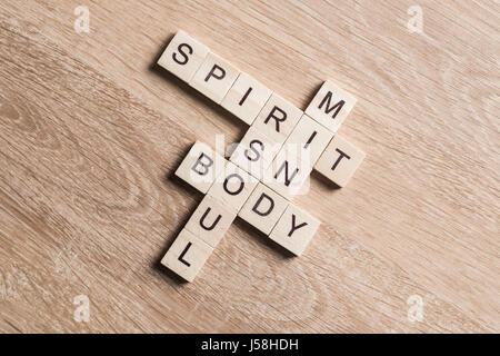 Spirit soul mind and body words made of wooden cubes Stock Photo