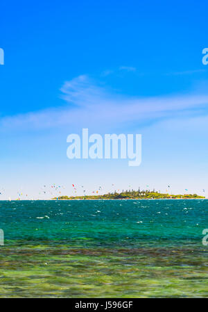 Kiteboarding around the tropical island Ilot Maitre in New Caledonia Stock Photo