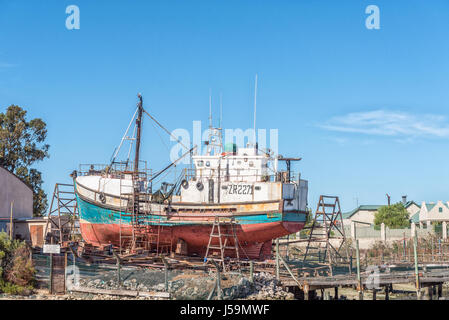 LAAIPLEK, SOUTH AFRICA - APRIL 1, 2017: A fishing boat being repaired on a slipway at the harbor in the mouth of the Berg River at Laaiplek on the Atl Stock Photo