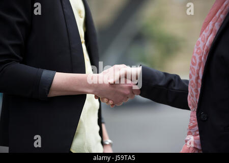 Close up of two Caucasian business women shaking hands. Stock Photo