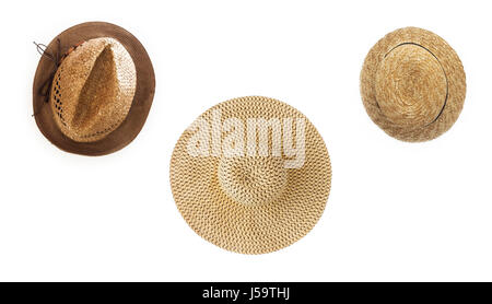 Collage of several straw hats of different shapes, isolated on white background, close-up. Stock Photo