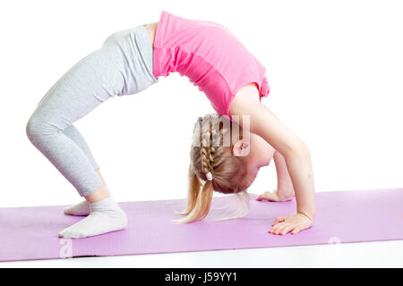 kid girl doing gymnastics on fitness mat Stock Photo