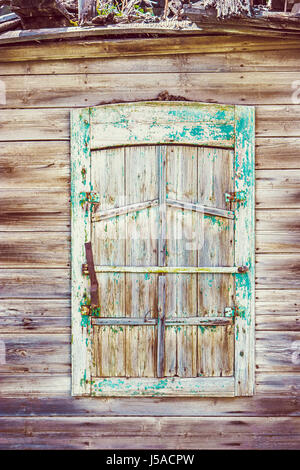 Weathered Wooden Window of old Russian  Slum House in Astrakhan Stock Photo