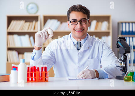 Scientist working on organic fruits and vegetables Stock Photo