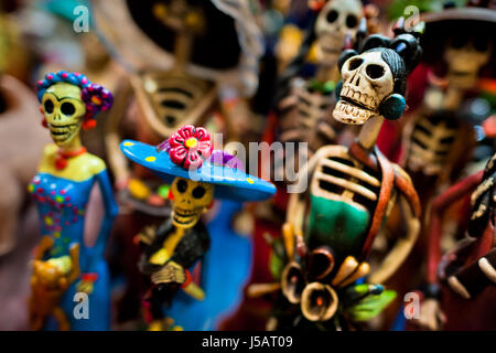 Calaca figurines are sold on the market during the Day of the Dead ...