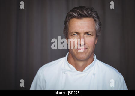 Portrait of handsome chef in restaurant Stock Photo