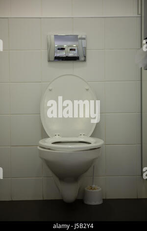 White toilet bowl in bathroom at school Stock Photo