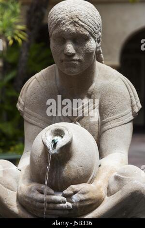 Aztec Woman of Tehuantepec, outdoor 1935 fountain and sculpture by Donal Hord, in Balboa Park's House of Hospitality Courtyard, San Diego California Stock Photo