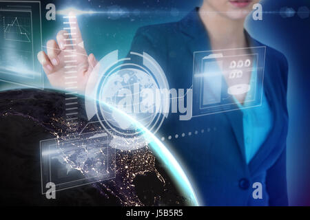 Cropped image of businesswoman using imaginative digital screen against blue background with vignette Stock Photo