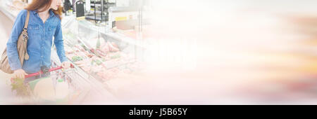 Customer looking for product at meat counter Stock Photo
