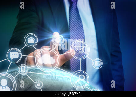 Businessman pointing against white background against blue background with vignette Stock Photo