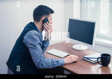 office worker takes an order by phone Stock Photo