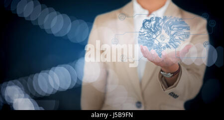 Businesswoman using digital screen against white background against defocused image of illuminated lights Stock Photo