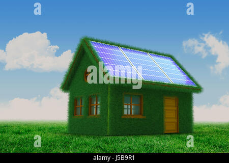 Small model of green house against scenic view of grassy field Stock Photo