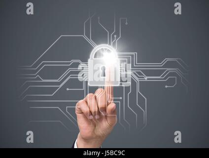 Digital composite of Hand with flare touching white lock graphic against grey background Stock Photo